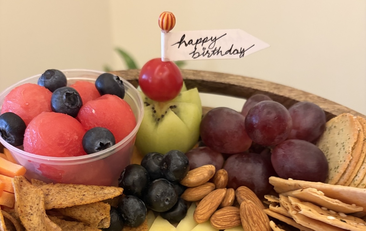A Gourmet Delights grazing platter gifted for a birthday, with a handwritten 'Happy Birthday' flag